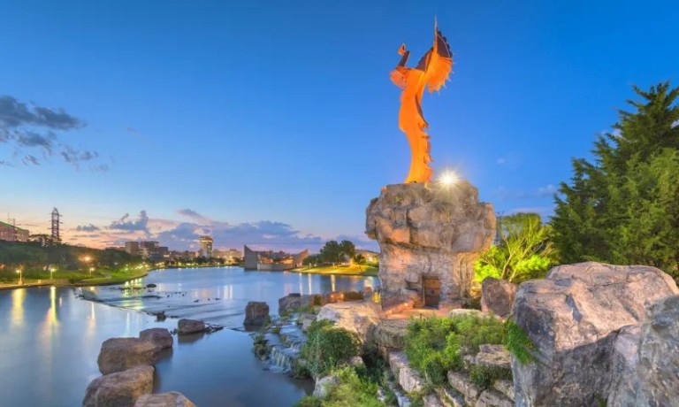 Witchita statue overlooking water
