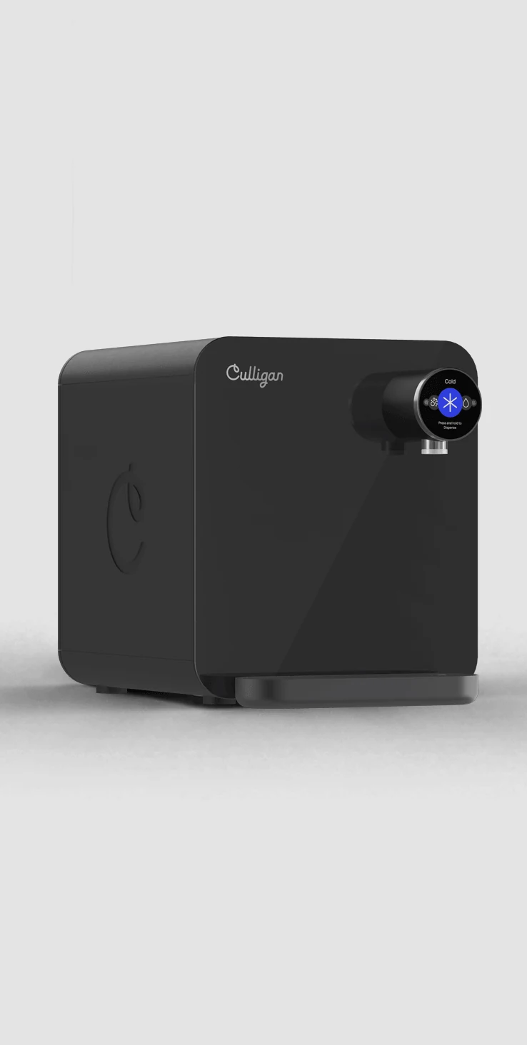 The Purity Advanced countertop unit, a black dispenser standing on its own base.