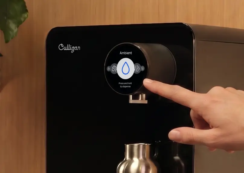 A finger on the Purity touchscreen, choosing ambient water.