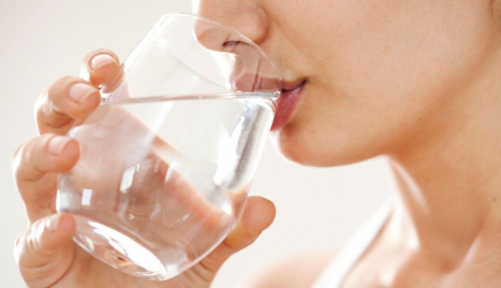 woman drinking glass of water