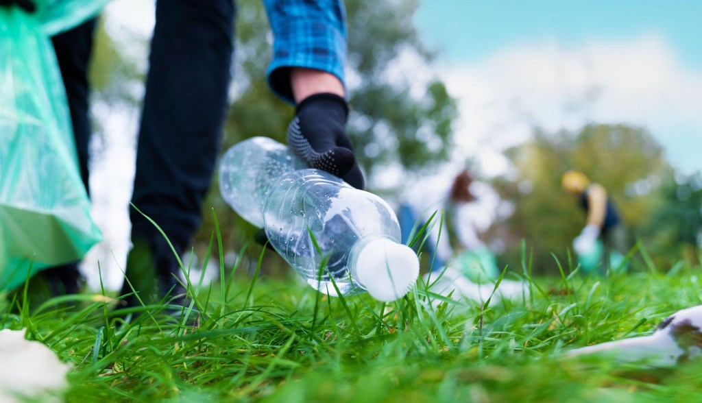 volunteers picking up plastic trash