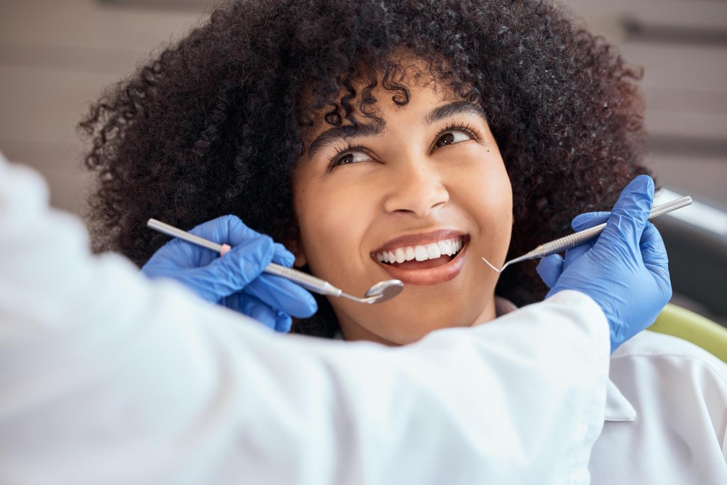 Woman smiling at dentist appointment