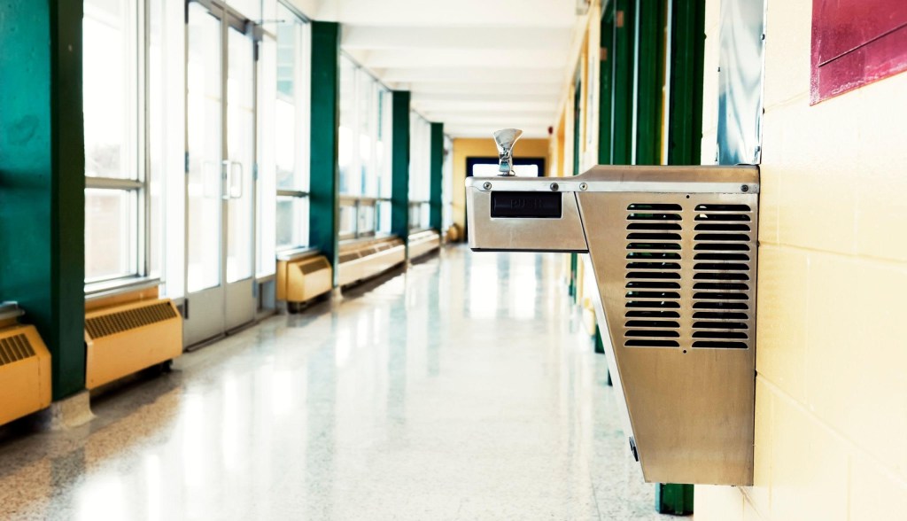 drinking fountain in school hallway