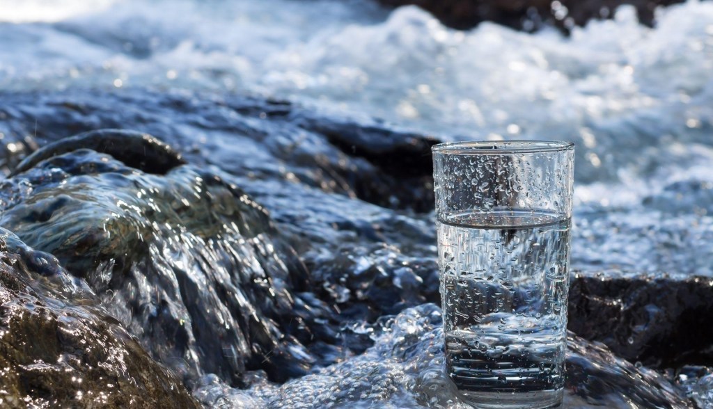 Waterfall with glass of water