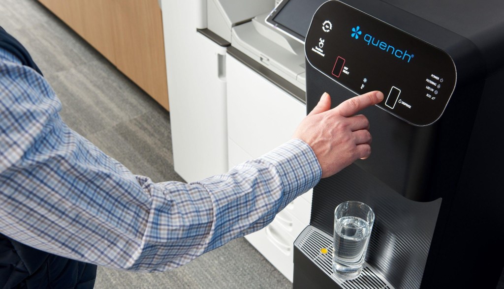 man using bottleless water cooler