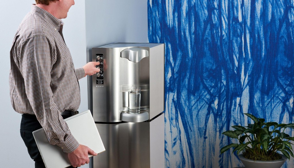 professional man using a bottleless water cooler