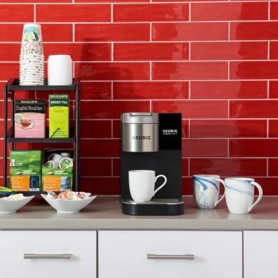 Quench coffee brewer on a red background