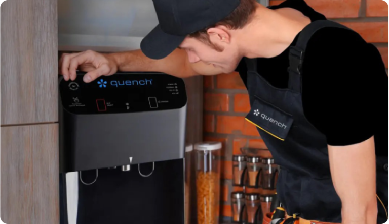 Culligan quench service tech with arm on water cooler