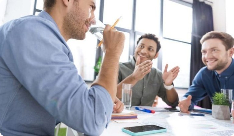 business meeting with men drinking glasses of water