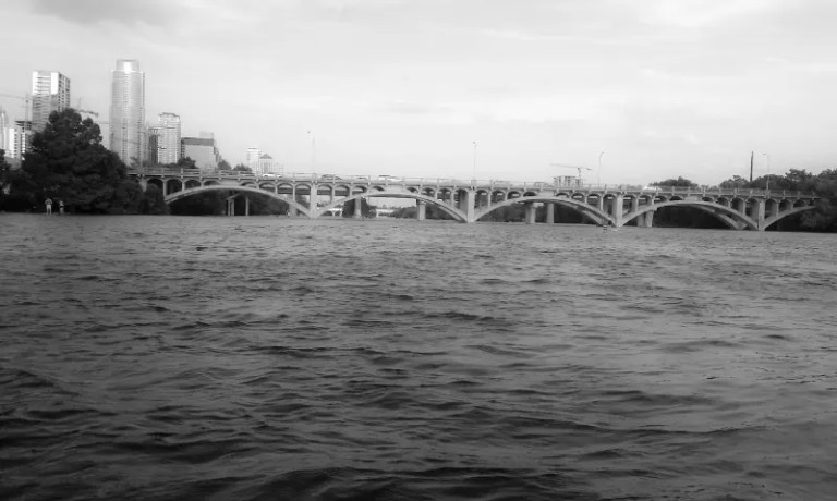 Austin bridge and city with water