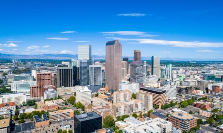 Denver city skyline with rocky mountains in the background