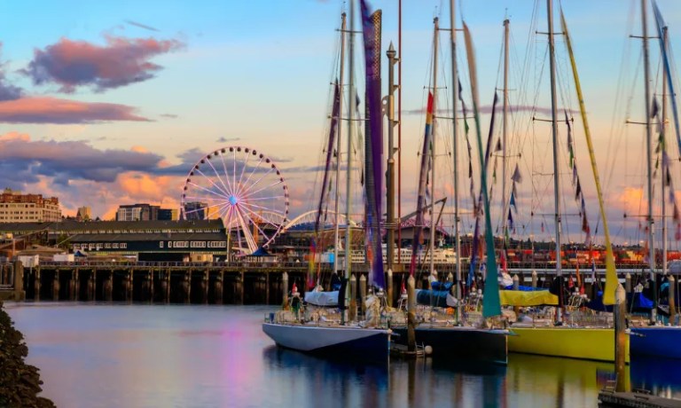 Seattle waterfront at sunset with boats on Puget Sound