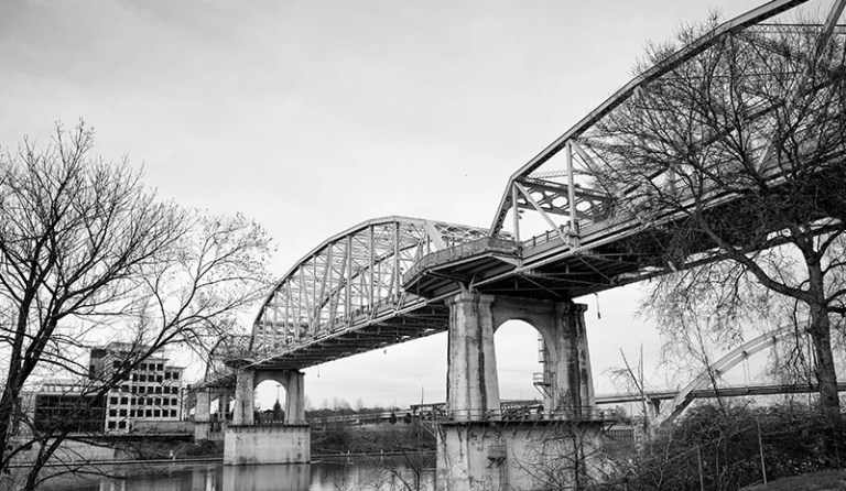 Black and White image of traditional bridge across water over sky in Nashville Tennessee, USA