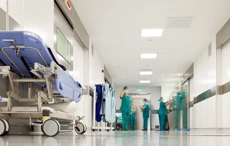 blurry image of hospital with doctors in the background