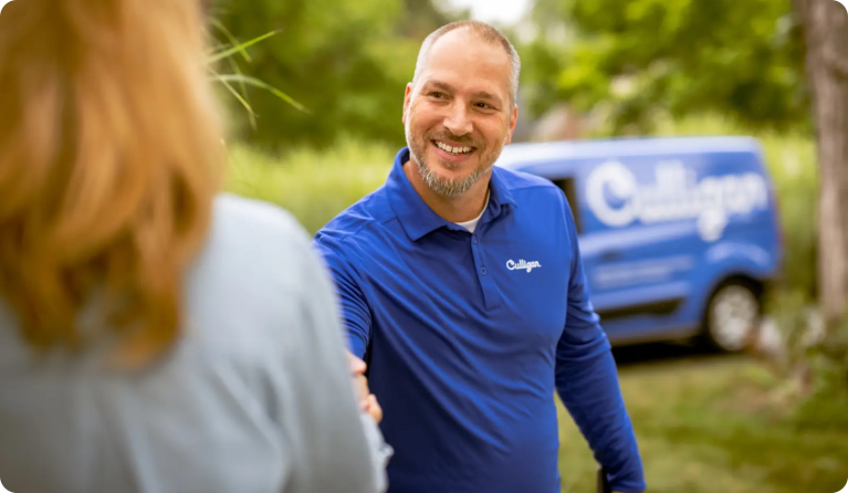 Service tech shaking hands with customer
