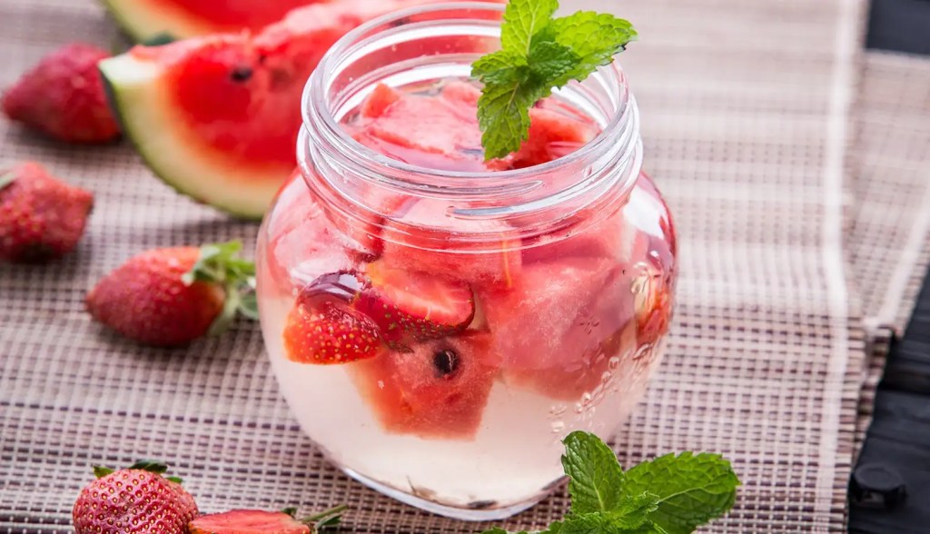 watermelon and mint water in a glass on a table